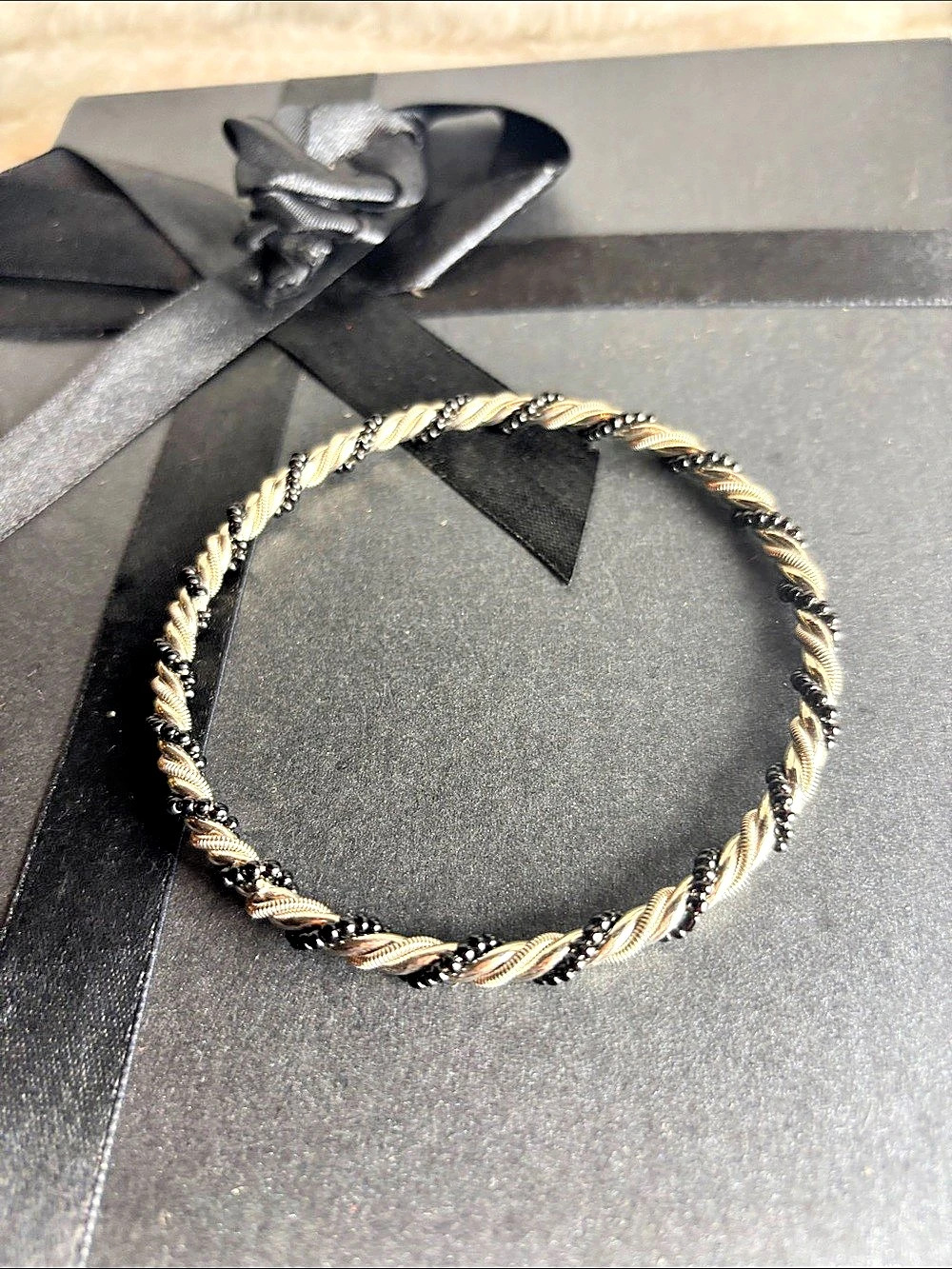 Two-Tone Twisted Bracelet in Black & Gold Like New